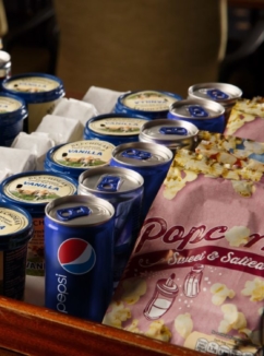 Tubs of ice cream and popcorn on a tray