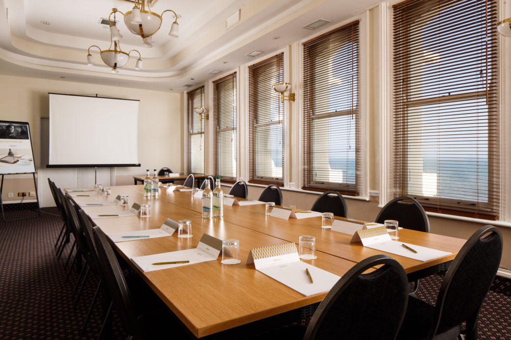 Coast View meeting room at Mercure Brighton Seafront Hotel, boardroom table and projector screen