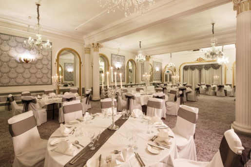 The Ballroom at Mercure Brighton Seafront Hotel arranged for a Wedding Breakfast, grey and silver colour theme