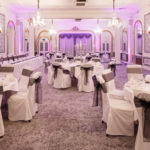 The Ballroom at Mercure Brighton Seafront Hotel arranged for a Wedding Breakfast, grey and silver colour theme with purple lights