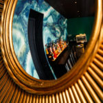 Reflection of the bar from a gold mirror at the NH Bar at Mercure Brighton Seafront The Norfolk Hotel